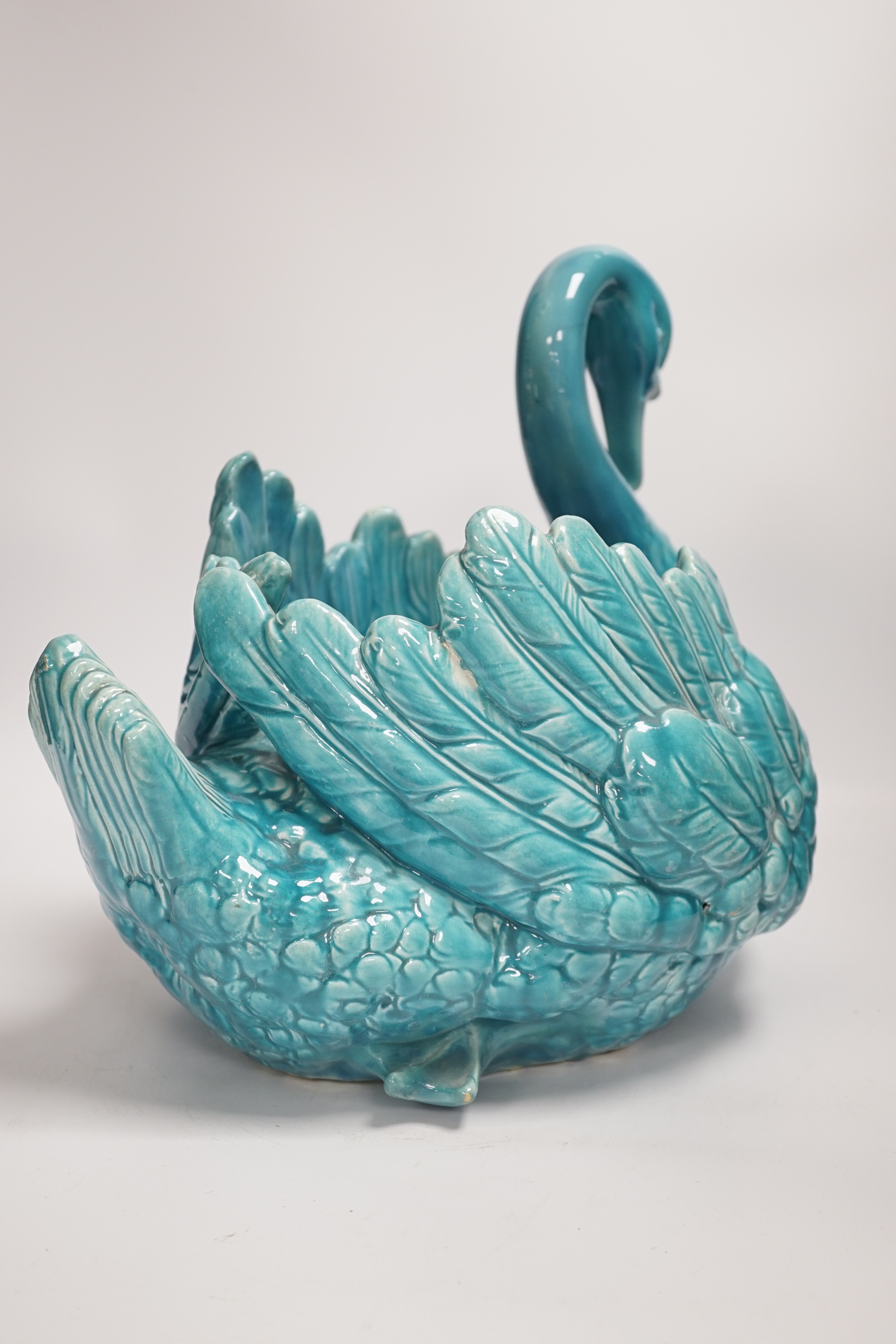 A large turquoise majolica swan, 31.5cm